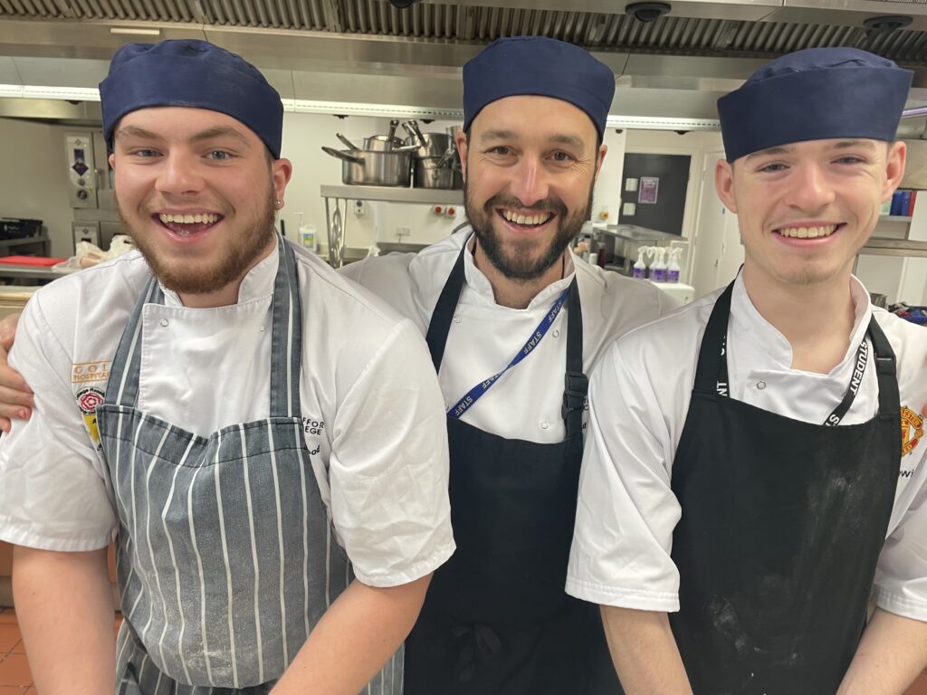 Hospitality students Ben Metcalf and Finlay Wood with their tutor Paul Taylor.